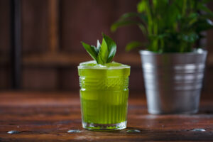 Green cocktail in rocks glass